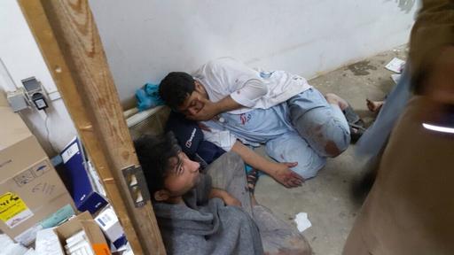 MSF staff in shock in one of the remaining parts of MSF's hospital in Kunduz, in the aftermath of sustained bombing 03 October 2015. Photo: ©MSF