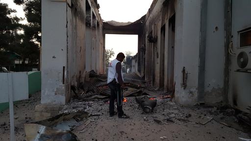 An MSF staff member walks through the grounds of the Kunduz trauma centre, 03 October, hours after it was badly damaged from sustained bombing on Saturday October 3.